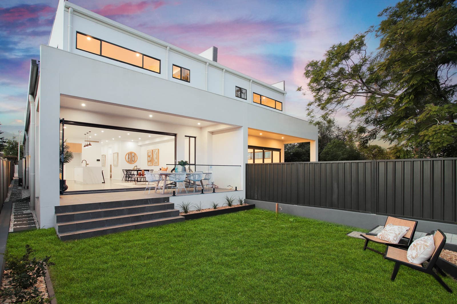 Dual Residence — rear courtyard at dusk